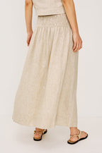 Wide Smocked Waistband and A-Line Silhouette in Heathered Flax Colorway - Lower Body Back View Featured on Model