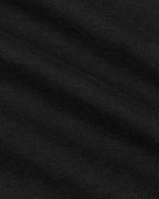 Black knit fabric close-up of the All Black Tall Classic Polo.
