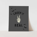 Halloween-themed card with skeleton hand and text on a gray background