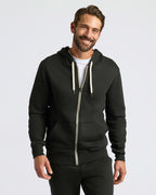 Black Fleece French Terry Zip Hoodie worn by smiling man.