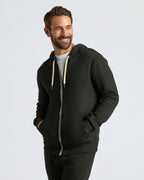 Man in Black Fleece French Terry Zip Hoodie, smiling.