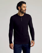 Man in Black Tall Classic Long Sleeve Henley with tattooed hand.