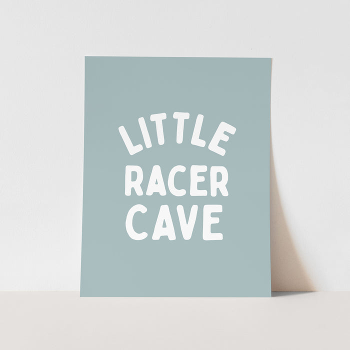 Light blue card with 'Little Racer Cave' text on a light gray background