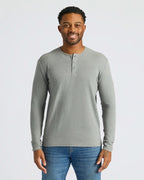 Man wearing Heather Gray Classic Long Sleeve Henley and blue jeans.