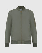 Carbon Bomber Jacket with ribbed collar, orange lining, and brass zippers.