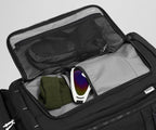 Gloves, beanie, and ski googles packed in the front flap pocket