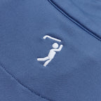 The Cooler Blue - Q-Zip features a white embroidered logo of a simplified golf figure swinging a club on blue, smooth, slightly stretchy fabric with athletic fit and moisture-wicking performance.