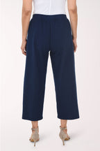 Navy blue pants with gold buttons on a white background
