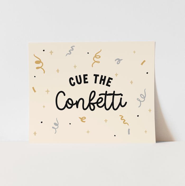 Card with 'Cue the Confetti' text and confetti illustrations on a beige background