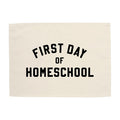 Beige cloth with 'First Day of Homeschool' text on a white background
