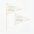 Two triangular flags with 'First Day of School' and 'Last Day of School' text on a white background.