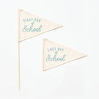 Two triangular flags with 'First Day of School' and 'Last Day of School' text on a white background.