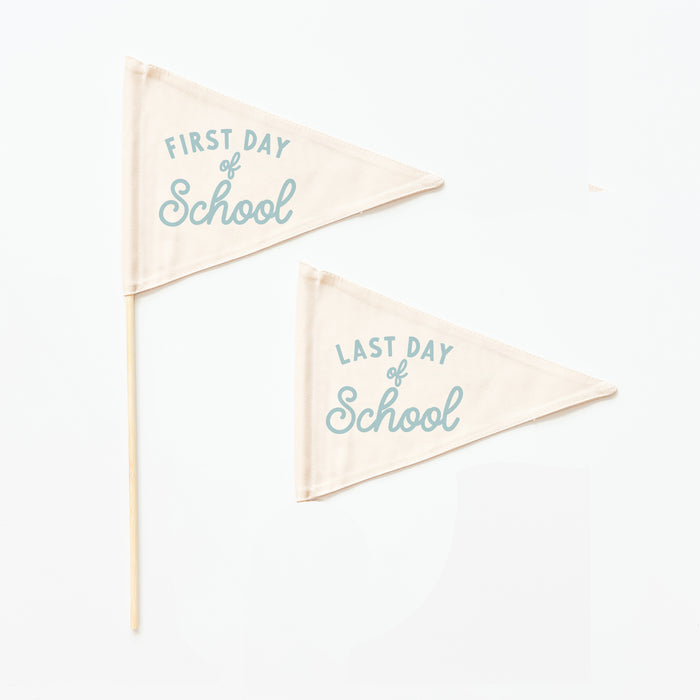 Two triangular flags with 'First Day of School' and 'Last Day of School' text on a white background.
