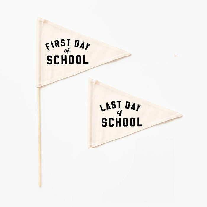 Two triangular flags with 'First Day of School' and 'Last Day of School' text on a white background.