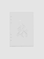 Light grey, semi-transparent, and glossy plastic planner dashboard with organic raised shape design in size A5 on a neutral background.
