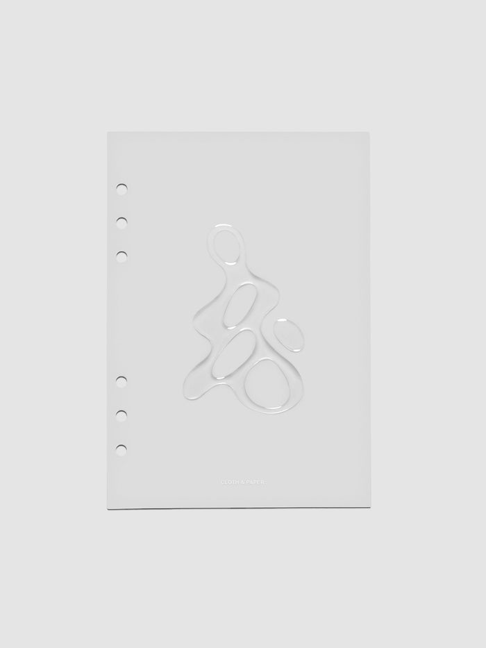 Light grey, semi-transparent, and glossy plastic planner dashboard with organic raised shape design in size A5 on a neutral background.