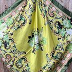 Yellow and green floral silk scarf.
