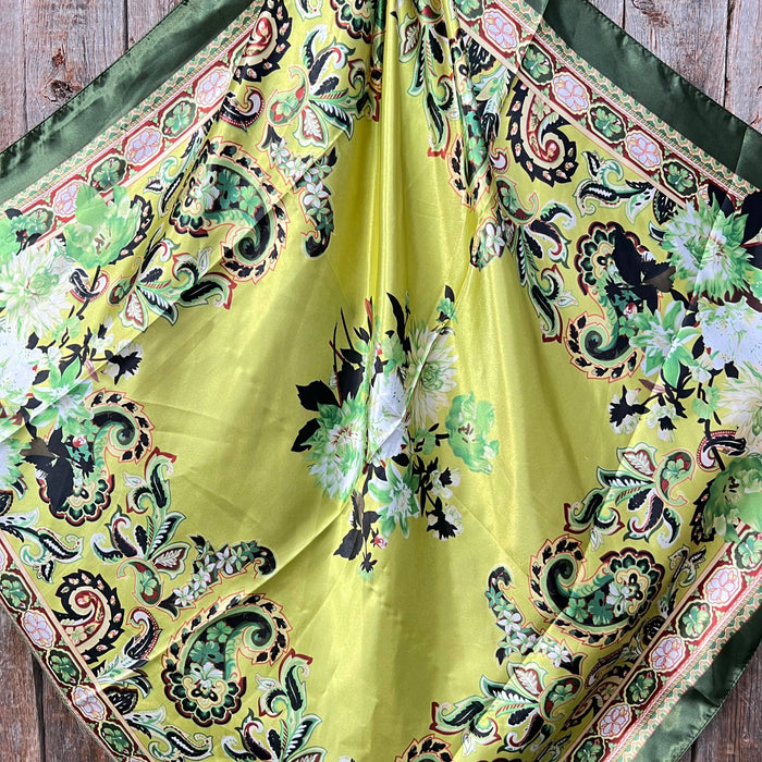 Yellow and green floral silk scarf.