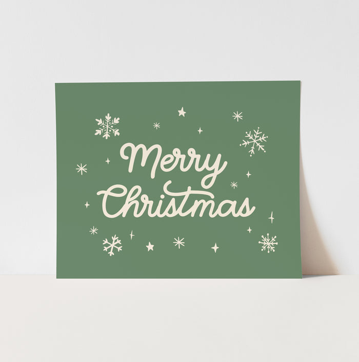 Green Christmas card with 'Merry Christmas' text and snowflakes on a white background