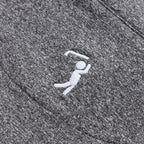 Close-up of the Heather Gray - Q-Zip's moisture-wicking fabric with a small white embroidered golfer. The crisp stitching pops against the soft, textured material, making it perfect for an athletic fit.