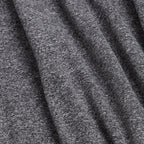 A close-up of the Heather Gray - Q-Zip shows soft, heathered fabric with visible texture and subtle folds. The thick, cozy material offers moisture-wicking properties for warmth and comfort.
