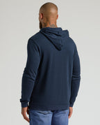Man wearing Heather Gray & Navy Waffle Hoodie, back view.
