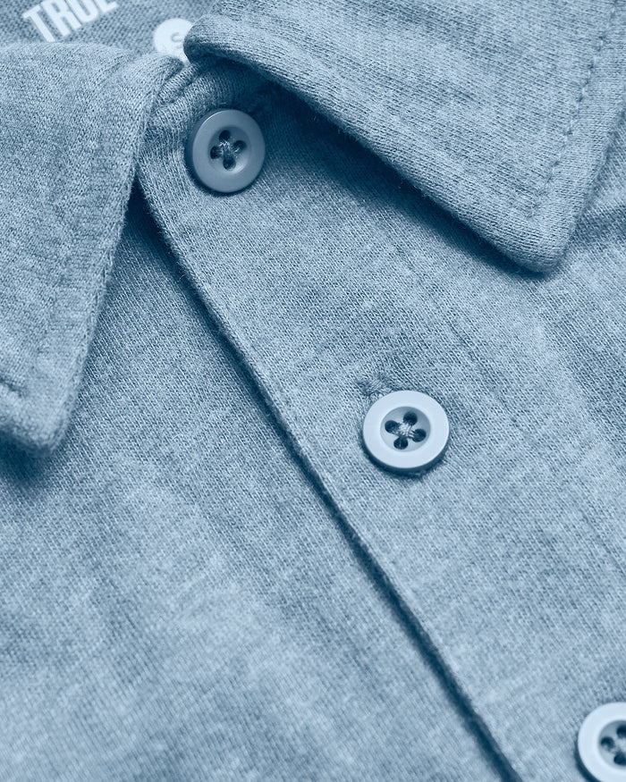 Heather Indigo Short Sleeve Tall Polo with folded collar and top buttons.