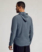 Heather Navy Active Shell Jacket worn by man, side view.