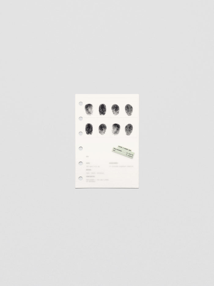 Two layered pocket sized planner dashboards, one semi-transparent, one matte, featuring a fingerprint design.