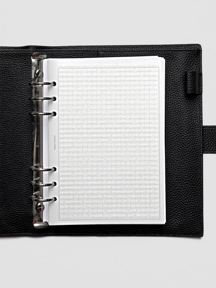 A5 Impressions Dashboard shown inside a ring-bound planner with translucent layering.