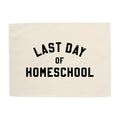 Beige towel with 'Last Day of Homeschool' text on a white background