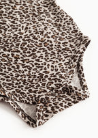 Leopard-patterned dark brown body with buttons at the leg opening.