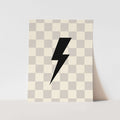 Checkered patterned paper with a black lightning bolt design on a light gray background