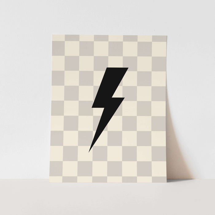 Checkered patterned paper with a black lightning bolt design on a light gray background