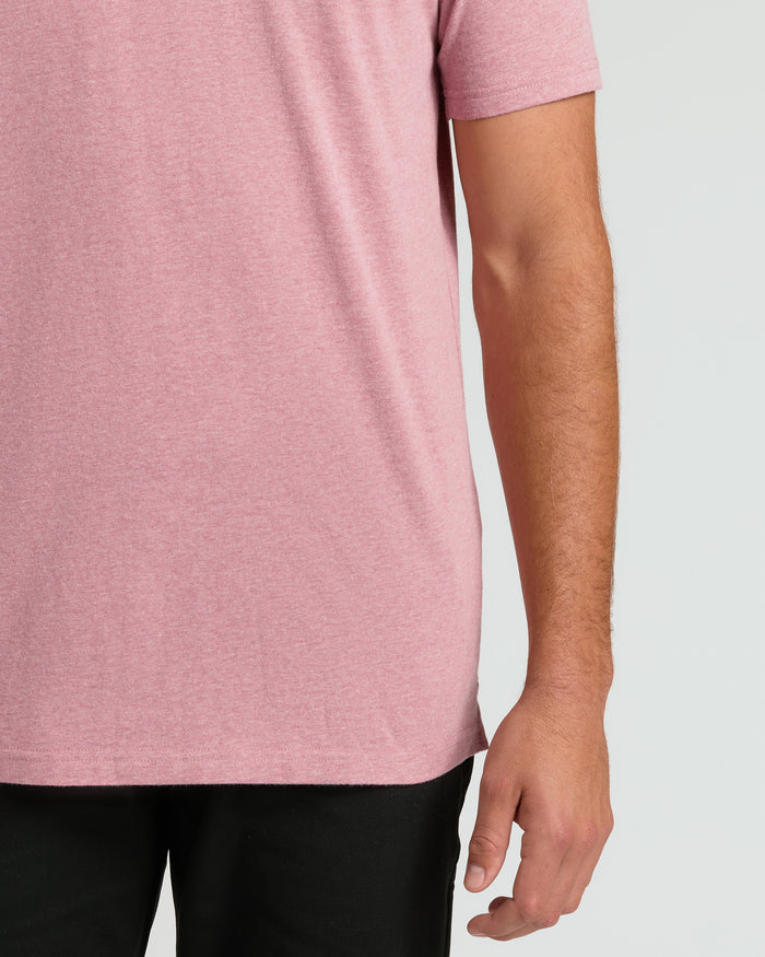 Midsection wearing Light Heather Boysenberry Short Sleeve Tall Polo and black pants.