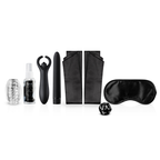 The contents of the LoveBoxxx First Together Starter Set arranged, including a clear masturbator sleeve, toy cleaner spray, two black vibrators (a couple's toy and a bullet), two black satin strips for handcuffs, a black satin blindfold, and a black sex dice.