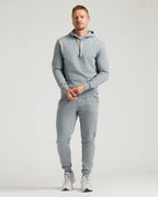 Medium Heather Gray Tall Fleece French Terry Pullover Hoodie on man standing.