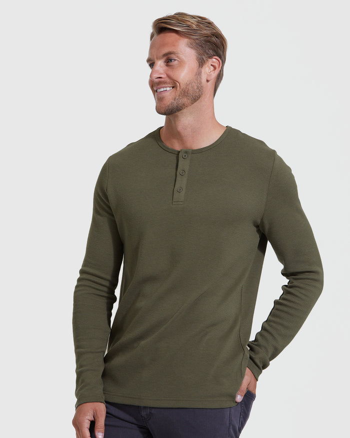 Model in Military Green Waffle Long Sleeve Henley and dark pants.
