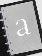 Monogram Vellum Planner Dashboard A in use in a leather planner.