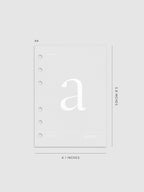 Monogram Vellum Planner Dashboard A in A6 displayed on a neutral background.