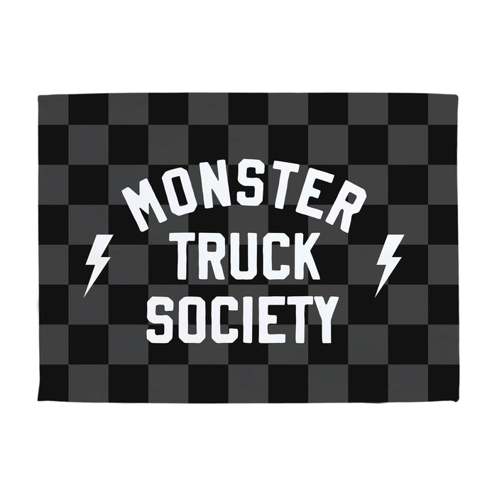 Checkered flag with 'Monster Truck Society' text and lightning bolts on a white background