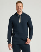 Man in Navy Tall Fleece Pullover Hoodie & Joggers, smiling.