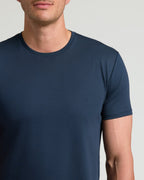 Close-up of a man wearing a Navy Tall Pima Cotton Blend Curved Hem Crew, showcasing the smooth fabric and classic crew neckline in a men's basics style.