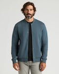Man wearing Neptune Fleece Bomber Jacket, layered over a T-shirt.