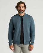 Man wearing Neptune Fleece Bomber Jacket, layered over a T-shirt.