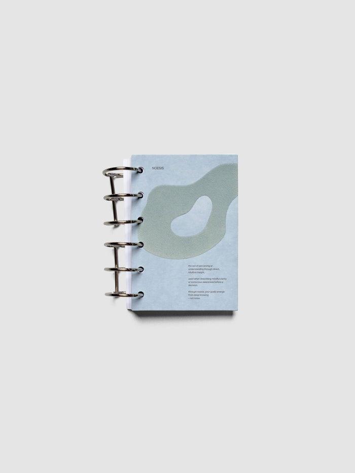 Blue speckle cardstock planner dashboard with organic shape design flocked in blue-green with text design shown in pocket size with ring binding.