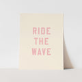 Beige poster with 'RIDE THE WAVE' text in pink on a light gray background