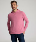 Model is wearing UNTUCKit Weatherby Performance Hoodie in Rose Wine.