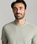 Model is wearing UNTUCKit Clarendon performance tee in shadow.