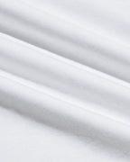 Close-up view of soft white fabric texture highlighting the smooth weave and quality craftsmanship of the Pima Cotton Blend Curved Hem Crew 4-Pack, a men's basics essential.
